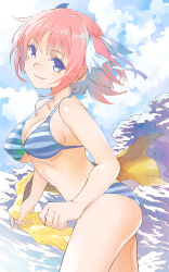 1girl bikini blue_bikini blue_eyes blue_sky breasts butterfly_hair_ornament closed_mouth commentary cowboy_shot from_side go-toubun_no_hanayome hair_ornament highres hirokiku holding holding_unworn_clothes holding_unworn_scarf looking_at_viewer medium_breasts medium_hair nakano_nino pink_hair scarf sky solo striped_bikini striped_clothes swimsuit unworn_scarf
