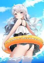 1girl ass beach black_one-piece_swimsuit blue_sky blush casual_one-piece_swimsuit cloud day dress dress_swimsuit fake_horns frilled_innertube grey_eyes grey_hair hair_ornament headgear highres horned_headwear horns i-201_(kancolle) i-201_(swimsuit)_(kancolle) kantai_collection long_hair looking_at_viewer looking_back low_twintails ocean official_alternate_costume one-piece_swimsuit outdoors polka_dot polka_dot_dress polka_dot_swimsuit sky solo swim_ring swimsuit swimsuit_skirt twintails water x_hair_ornament yellow_innertube yomogi_dango