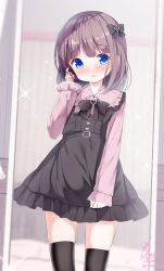 1boy artist_name black_bow black_dress black_hair black_thighhighs blue_eyes blunt_bangs blurry blurry_background blush bow breasts chinomaron cowboy_shot dress eyebrows_hidden_by_hair frills hair_between_eyes hair_bow hair_ornament hand_on_own_ear hand_up heart-shaped_ornament highres lace_trim long_hair long_sleeves looking_at_viewer mirror original pinafore_dress pink_sleeves pleated_dress ribbon sidelocks signature sleeveless sleeveless_dress small_breasts solo thighhighs trap zettai_ryouiki
