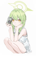 1girl absurdres alternate_costume alternate_hairstyle bare_arms blue_archive blush braid camera closed_mouth dress green_skirt highres hikari_(blue_archive) holding holding_camera long_hair looking_at_viewer pointy_ears rainer7278 skirt sleeveless sleeveless_dress solo squatting twin_braids white_dress yellow_eyes