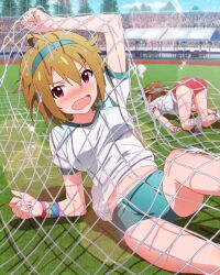 2girls ahoge artist_request ass blush brown_hair buruma card_(medium) crowd feet_out_of_frame futami_ami grass green_buruma ibuki_tsubasa idolmaster idolmaster_million_live! idolmaster_million_live!_theater_days lens_flare midriff multiple_girls navel net official_art open_mouth pink_eyes red_buruma track_and_field tree wristband