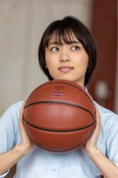 1girl ball basketball_(object) black_hair blurry blurry_background flat_chest japanese_(nationality) looking_to_the_side monami_suzu photo_(medium) school_uniform short_hair