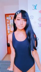 1girl animated black_hair braces breasts cosplay dark-skinned_female dark_skin ear_piercing fingernails hair_ornament hairclip iisabellasz ijiranaide_nagatoro-san long_fingernails long_hair looking_at_viewer nagatoro_hayase nagatoro_hayase_(cosplay) navel one_eye_closed piercing school_swimsuit shorts small_breasts solo swimsuit thigh_gap video wink