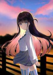 1girl absurdres arms_behind_back basori_tiara black_hair blue_bow blue_bowtie blue_eyes blue_thighhighs bow bowtie chinese_commentary closed_mouth colored_inner_hair commentary_request evening fence from_side gora_mclaren grey_skirt highres long_hair long_sleeves looking_at_viewer make_heroine_ga_oo_sugiru! mole mole_on_neck multicolored_hair official_alternate_hairstyle outdoors pleated_skirt school_uniform shirt shirt_tucked_in skirt smile solo standing summer_uniform thighhighs tsuwabuki_high_school_uniform two-tone_thighhighs two_side_up white_shirt white_thighhighs zettai_ryouiki