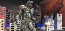 Rule 34 | 1boy, adapted costume, armor, batzemo, blue eyes, city, convention, cosplay, cosplay photo, destruction, dinosaur, glowing, glowing eyes, godzilla, godzilla: king of the monsters, godzilla (cosplay), godzilla (monsterverse) (cosplay), godzilla (series), godzilla vs. king ghidorah, kaiju, legendary pictures, monsterverse, no pupils, personification, photo (medium), real life, salvador hernandez, spikes, toho