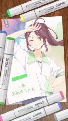 1girl alt_text arm_up artist_name bike_shorts black_shorts brown_hair character_name closed_mouth collarbone commentary_request copic_(brand) cowboy_shot drop_shadow floating_hair goto_akira green_background green_eyes hand_on_own_hip highres ikizulive!_love_live!_bluebird jacket long_hair looking_at_viewer love_live! marker matsurugi_tsukasa paperclip ponytail shirt short_sleeves shorts sidelocks sleeves_pushed_up smile solo split_mouth white_jacket white_shirt