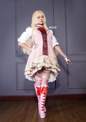 1girl blonde_hair boots breasts cosplay cosplay_photo door dress emilie_de_rochefort emilie_de_rochefort_(cosplay) fingerless_gloves gloves hand_on_own_hip long_hair mercifulyuyu photo_(medium) real_life tekken tekken_8 wooden_floor