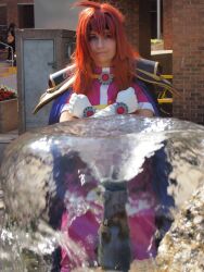 1girl cosplay_photo gloves lina_inverse photo_(medium) slayers solo water white_gloves