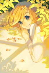 1girl blonde_hair blue_eyes closed_mouth head_on_hand highres leaf long_hair looking_to_the_side lying natsumika on_stomach original own_hands_together petal_on_head petals plant shadow smile solo sunlight swept_bangs upper_body white_hair window_shadow