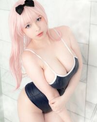 Rule 34 | 1girl, bare shoulders, bathroom, black bow, blue eyes, bow, breasts, cosplay, cosplay photo, fujiwara chika, fujiwara chika (cosplay), highres, kaguya-sama wa kokurasetai ~tensai-tachi no renai zunousen~, large breasts, long hair, looking at viewer, one-piece swimsuit, photo (medium), pink hair, real life, sleeveless, swimsuit, yoshinobi cos