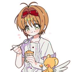 1girl blush brown_hair cardcaptor_sakura closed_mouth collarbone crumbs cupcake dress food fork green_eyes hair_ribbon highres holding holding_food holding_fork kero_(cardcaptor_sakura) kinomoto_sakura looking_at_viewer red_ribbon ribbon short_hair short_sleeves signature simple_background smile upper_body white_background white_dress wings yalmyu