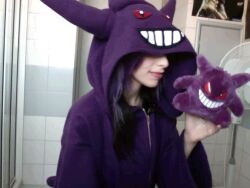 1girl animated animated_gif gen_1_pokemon gengar hood hood_up hoodie licking nintendo pokemon real_life stuffed_toy
