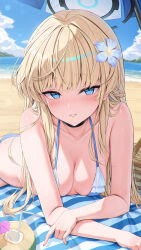 1girl absurdres alternate_costume beach_mat beach_umbrella bikini blonde_hair blue_archive blue_bikini blue_eyes blue_flower blue_halo blush breasts cleavage cocktail_umbrella coconut_cup commentary_request day drinking_straw flower fruit_cup hair_flower hair_ornament halo highres long_hair looking_at_viewer lying medium_breasts ocean on_stomach outdoors rosumerii solo swimsuit toki_(blue_archive) umbrella