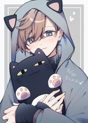 1boy :3 animal_hood blush brown_hair cat_day closed_mouth grey_eyes hair_between_eyes highres holding holding_stuffed_toy hood hood_up kanae_(11th_costume)_(nijisanji) kanae_(nijisanji) long_sleeves male_focus mole mole_under_eye nekojiri nijisanji paw_print roto_(kanae) simple_background sleeves_past_wrists solo stuffed_animal stuffed_cat stuffed_toy upper_body virtual_youtuber