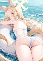 1girl alternate_costume animal_ear_fluff animal_ears ass back bare_arms bare_shoulders beach blonde_hair blue_archive blush breasts brown_eyes closed_mouth commentary cross_halo day ear_wreath extra_ears flower flower_wreath forehead fox_ears fox_girl fox_tail from_behind halo highres jewelry long_hair looking_at_viewer looking_back lying ocean on_stomach one-piece_swimsuit outdoors parted_lips red_eyes rong_yi_tan seia_(blue_archive) small_breasts smile solo swimsuit tail thighs very_long_hair water wet yellow_eyes yellow_halo