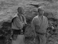 2boys animated bald facial_hair grave hill holster japanese_clothes japanese_text katana kimono long_sleeves male_focus mitsudomoe_(shape) monochrome multiple_boys music outdoors planted planted_sword planted_weapon samurai shichinin_no_samurai shichiroji shichirooji shimada_kanbei short_hair singing sky sound spoilers stone subtitled sword talking the_end_(phrase) toho tomoe_(symbol) topknot video weapon