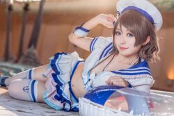 Rule 34 | 1girl, blue eyes, blurry, blurry background, cosplay, cosplay photo, costume, grey hair, hat, indoors, japanese (nationality), looking at viewer, love live!, love live! sunshine!!, mi yan 0728, navel, on floor, open clothes, photo (medium), poolside, short hair, skirt, solo, swim ring, thighhighs, watanabe you