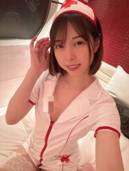 1girl aoi_rena bedroom censored costume flat_chest hat japanese_(nationality) looking_at_viewer nurse nurse_cap on_bed photo_(medium) real_life selfie short_hair