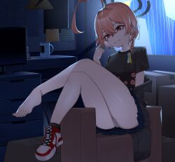 1girl ahoge black_halo black_shirt blue_archive braid chirpy closed_mouth cup hair_between_eyes halo highres indoors legs mole mole_under_eye neru_(blue_archive) neru_(school_uniform)_(blue_archive) red_eyes red_hair shirt shoes short_sleeves single_braid single_shoe sitting solo t-shirt
