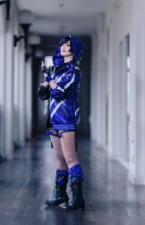1girl black_boots blurry blurry_background boots cosplay cosplay_photo female_focus fingerless_gloves gloves high_heel_boots high_heels highres hood hooded_jacket jacket looking_at_viewer namco photo_(medium) purple_jacket real_life reina_(tekken) reina_(tekken)_(cosplay) shioncos short_hair smile solo standing tekken tekken_8