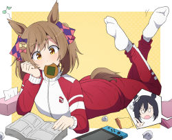 2girls anger_vein animal_ears black_hair blank_eyes bow brown_hair cellphone eishin_flash_(umamusume) elbow_rest feet_up food hair_bow head_rest horse_ears horse_girl horse_tail index_finger_raised jacket long_sleeves lying manga_(object) medium_hair mouth_hold multiple_girls musical_note nel-c nintendo_switch on_stomach pants phone red_jacket red_pants senbei smart_falcon_(umamusume) socks spoken_character tail the_pose tissue_box track_jacket twintails umamusume white_socks yellow_eyes