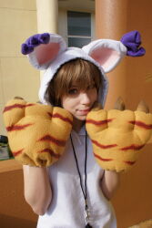 1girl brown_hair cosplay_photo digimon digimon_adventure lips photo_(medium) real_life smile solo tailmon_(cosplay) yagami_hikari
