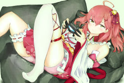 1girl bell blush bow clochetteravine controller couch detached_sleeves floral_print game_controller green_eyes hair_bell hair_ornament hair_ribbon highres holding hololive japanese_clothes kimono long_hair long_sleeves looking_at_viewer lying nontraditional_miko pillow pink_hair pink_shorts playing_games playstation_controller ponytail print_skirt red_skirt ribbon sakura_miko shorts side_ponytail single_thighhigh skirt sleeveless sleeveless_kimono sony thigh_strap thighhighs video_game virtual_youtuber white_kimono white_thighhighs wide_sleeves x_hair_ornament