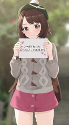 Rule 34 | 1girl, absurdres, amayo thranana, backpack, bag, blurry, blurry background, brown bag, brown eyes, brown hair, buttons, cable knit, cardigan, closed mouth, collared dress, commentary request, cowboy shot, dress, dynamax band, gloria (pokemon), green hat, grey cardigan, hands up, hat, heart, highres, holding, holding sign, hood, hood down, hooded cardigan, nintendo, pink dress, pokemon, pokemon swsh, short hair, sign, smile, solo, split mouth, tam o&#039; shanter, translation request