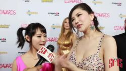 Rule 34 | 2girls, animated, asian, audible speech, black hair, breasts, brown eyes, cleavage, dress, earrings, english audio, huge breasts, indoors, interview, japanese (nationality), jewelry, kiss, long dress, matching hair/eyes, microphone, multiple girls, necklace, okita anri, photo (medium), real life, shibuya kaho, size difference, sound, standing, tagme, video, yuri
