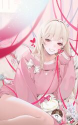 1girl absurdres blonde_hair blue_ribbon blush bottle bow box bra_strap breasts chinese_commentary chocolate commentary dress drink eyelashes feet_out_of_frame flower glass_bottle goddess_of_victory:_nikke grin hair_intakes hair_ornament hair_over_shoulder hairclip heart-shaped_box highres holding holding_ribbon indoors knees_up large_breasts long_hair looking_at_viewer lying nail_art off-shoulder_sweater off_shoulder on_bed on_side pillow pink_sweater reclining red_eyes red_ribbon ribbon sleeves_past_wrists smile solo sweater sweater_dress tia_(nikke) valentine white_bow white_flower willow_(user_xagu3384)