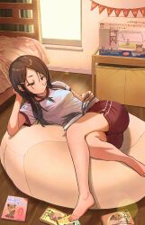 1girl barefoot bean_bag_chair bed book brown_eyes brown_hair closed_mouth commentary_request dot_mouth fingernails gym_uniform hair_ornament hairclip highres indoors long_hair original reading red_shorts shirt shorts solo toenails toraneko translation_request white_shirt