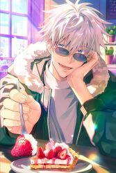 1boy blue_eyes cake colored_eyelashes food fork fruit fur_collar gojou_satoru green_jacket hand_on_own_cheek hand_on_own_face highres holding holding_fork indoors jacket jujutsu_kaisen looking_at_viewer lower_teeth_only male_focus plant plate potted_plant shibakawaiiii shirt short_hair smile solo strawberry teeth white_eyelashes white_hair white_shirt window yellow-framed_eyewear