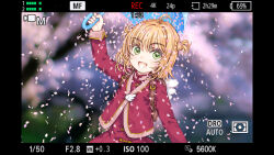 1girl backpack bag blush cardcaptor_sakura cherry_blossoms commentary_request focke_wulf green_eyes highres holding holding_umbrella jacket kinomoto_sakura looking_at_viewer open_mouth orange_hair outdoors photo_background recording short_hair skirt smile solo umbrella upper_body