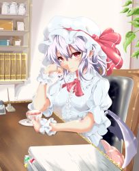 1girl absurdres ascot bad_id bad_pixiv_id bat_wings blouse blush book bookshelf chair commentary cup desk elbow_rest female_focus hair_between_eyes hat hat_ribbon head_rest head_tilt highres holding holding_cup indoors inkwell jar light_particles light_purple_hair looking_at_viewer mob_cap office_chair paper_stack pen_holder picture_frame puffy_short_sleeves puffy_sleeves red_ascot red_eyes remilia_scarlet ribbon saucer shirt short_hair short_sleeves sika_(kakakaka) sitting sitting_on_pillow skirt smile solo swivel_chair teacup touhou white_hat white_shirt white_skirt wings wrist_cuffs