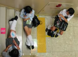 3girls asian bag from_above loose_socks multiple_girls photo_(medium) school_bag school_uniform serafuku sitting skirt socks