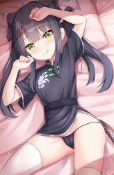 1girl :p bed_sheet belt black_dress black_hair black_panties blue_archive blunt_bangs cameltoe commentary dress english_commentary enru green_eyes hair_ribbon highres licking_lips loli long_hair looking_at_viewer lying on_back on_bed panties pillow ribbon short_sleeves shun_(blue_archive) shun_(small)_(blue_archive) sidelocks signature solo thighhighs thighs tongue tongue_out underwear