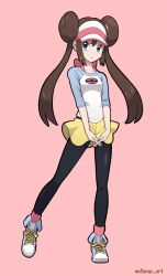 Rule 34 | 1girl, black pantyhose, blue eyes, blue shoes, brown hair, closed mouth, commentary request, double bun, full body, hair bun, highres, long hair, looking up, mollipop art, nintendo, pantyhose, pink background, pink socks, pokemon, pokemon bw2, raglan sleeves, rosa (pokemon), shirt, shoes, shorts, simple background, socks, solo, standing, three-quarter sleeves, twintails, visor cap, yellow shorts