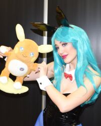 1girl alolan_form alolan_raichu animal_ears aqua_hair argentine_(nationality) bare_shoulders black_leotard blue_pantyhose bow bowtie breasts bulma bulma_(cosplay) cleavage cosplay curvy dragon_ball dragon_ball_(classic) fake_animal_ears female_focus gen_7_pokemon highleg highleg_leotard highres holding holding_pokemon leotard lips long_hair looking_ahead medium_breasts nintendo pantyhose photo_(medium) playboy_bunny pokemon pokemon_(creature) rabbit_ears real_life shiny_clothes solo sophie_valentine standing stuffed_animal stuffed_pokemon stuffed_toy wide_hips