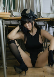 1girl black_hair black_one-piece_swimsuit blurry blurry_background breasts chair classroom desk gloves hat high_heels highres indoors japanese_(nationality) large_breasts legs_apart looking_at_viewer medium_hair on_floor one-piece_swimsuit photo_(medium) police_hat real_life school school_chair school_desk shinonome_umi swimsuit