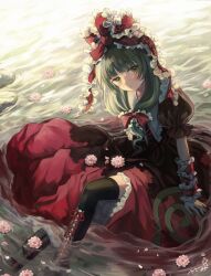 1girl arm_ribbon black_boots black_thighhighs blunt_bangs boots bow commission dress flower frilled_dress frills green_eyes green_hair highres kagiyama_hina long_hair looking_at_viewer outdoors red_bow red_dress red_ribbon ribbon sasami_(shiroi_fuwafuwa) sitting skeb_commission solo thighhighs touhou