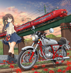 1girl absurdres arms_behind_back black_boots black_socks blue_sailor_collar boots bridge brown_hair bush cloud cloudy_sky dirt_road flower grass green_eyes green_ribbon hair_ribbon headphones highres honda honda_ac15 japan_railways lamppost long_hair long_sleeves looking_back mikeran_(mikelan) motor_vehicle motorcycle mountain multiple_unit_train neckerchief original outdoors pleated_skirt ponytail power_lines red_neckerchief ribbon road sailor_collar school_uniform serafuku shirt skirt sky socks solo sony spider_lily standing sunset train utility_pole walkman white_shirt