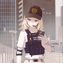 1girl absurdres bang_dream! bang_dream!_it&#039;s_mygo!!!!! blonde_hair building cellphone closed_mouth commentary elbow_pads gan_xing_naobing girls_band_cry hair_between_eyes hatsune_miku highres holding holding_phone load_bearing_vest medium_hair microphone misumi_uika name_connection outdoors phone purple_eyes real_world_location shinjuku_(tokyo) shirt smartphone solo tokyo_(city) vocaloid white_shirt