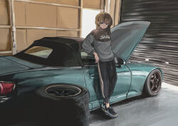 1girl absurdres black_pants bokuya brown_hair car full_body garage green_eyes highres honda honda_s2000 indoors jacket looking_at_viewer medium_hair motor_vehicle original pants solo standing track_jacket vehicle_focus
