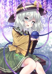 1girl :d black_hat blouse blush buttons commentary_request diamond_button eyeball feet_out_of_frame floral_print flower frilled_shirt_collar frilled_sleeves frills grass green_skirt grey_eyes grey_hair hat hat_ribbon highres holding_eyeball juugou_taki komeiji_koishi long_sleeves looking_at_viewer on_bench open_mouth outdoors print_skirt purple_flower ribbon rose_print shirt short_hair sitting skirt sleeves_past_wrists smile solo third_eye touhou wide_sleeves wisteria yellow_ribbon yellow_shirt