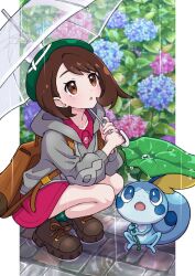 1girl brown_bag cable_knit cardigan dress floral_background gen_8_pokemon gloria_(pokemon) green_hat green_socks grey_cardigan hat highres holding holding_umbrella hood hooded_cardigan leaf nintendo pink_dress plaid_clothes plaid_socks pokemon pokemon_(creature) pokemon_swsh rain sobble socks tam_o&#039;_shanter umbrella yuu_(jgvj7873)