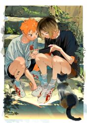 2boys atie1225 black_hair blonde_hair cat closed_mouth full_body haikyuu!! handheld_game_console highres hinata_shouyou holding holding_handheld_game_console kozume_kenma male_focus multicolored_hair multiple_boys nintendo_switch open_mouth orange_eyes orange_hair short_hair two-tone_hair