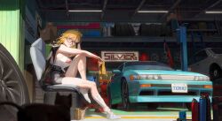 1girl absurdres black-framed_eyewear black_shorts blonde_hair blue_eyes blush breasts camisole car chair dirty from_below glasses highres indoors jacket jacket_on_shoulders ko-ma large_breasts leg_up long_hair looking_at_viewer motor_vehicle original paint_can shorts sitting solo unused_tire white_camisole