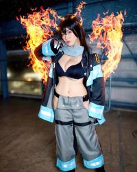 1girl black_bra bra breasts cosplay en&#039;en_no_shouboutai female_focus fire highres large_breasts long_hair looking_at_viewer model partially_undressed photo_(medium) shibuya_kaho smile solo tamaki_kotatsu tamaki_kotatsu_(cosplay) twintails underwear wig