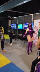 2girls 6+others animated argentine_(nationality) ass bare_shoulders blonde_hair braid breasts cammy_white cammy_white_(cosplay) cosplay crossover fighting_stance fingerless_gloves full_body gloves hat highleg highleg_leotard highres hika_cosplay holding holding_weapon indoors leotard long_hair mask mileena_(mortal_kombat) mortal_kombat_(series) mouth_mask multiple_boys multiple_girls multiple_others parted_lips photo_(medium) purple_leotard real_life shiny_clothes skindentation sleeveless smile sophie_valentine street_fighter tagme thong_leotard twin_braids very_long_hair video weapon