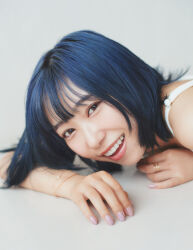 1girl blue_hair brown_eyes dress flat_chest indoors japanese_(nationality) kobayashi_aika lipstick looking_at_viewer makeup on_floor open_mouth photo_(medium) pink_nails real_life short_hair smile voice_actor white_background white_dress